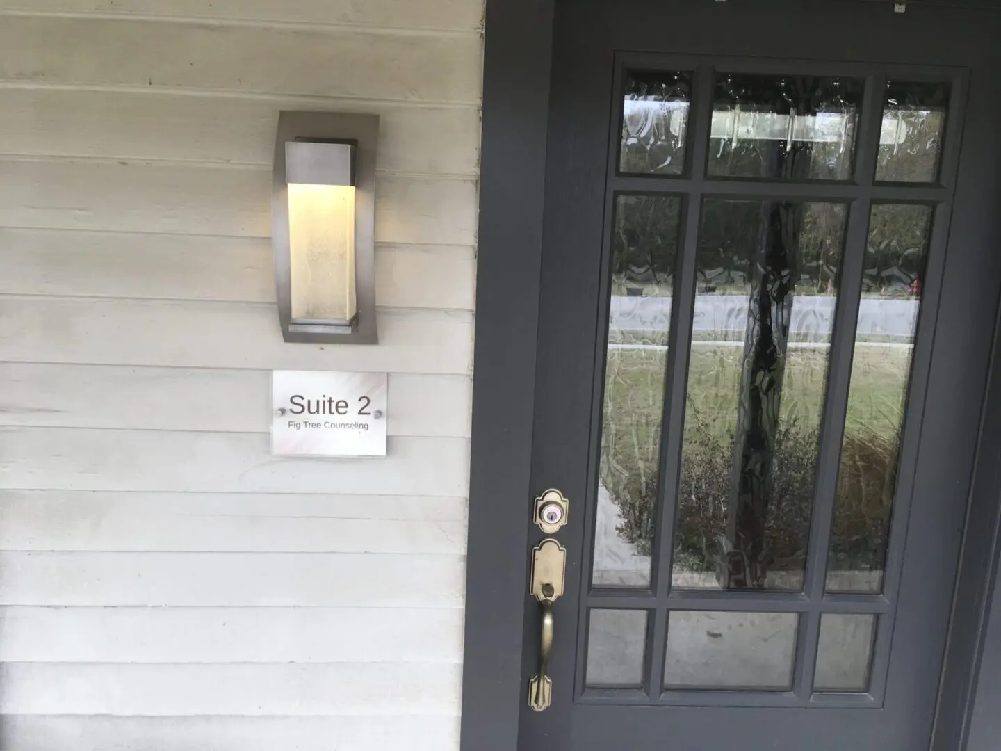 A door with a sign on it that says " suite 7 ".